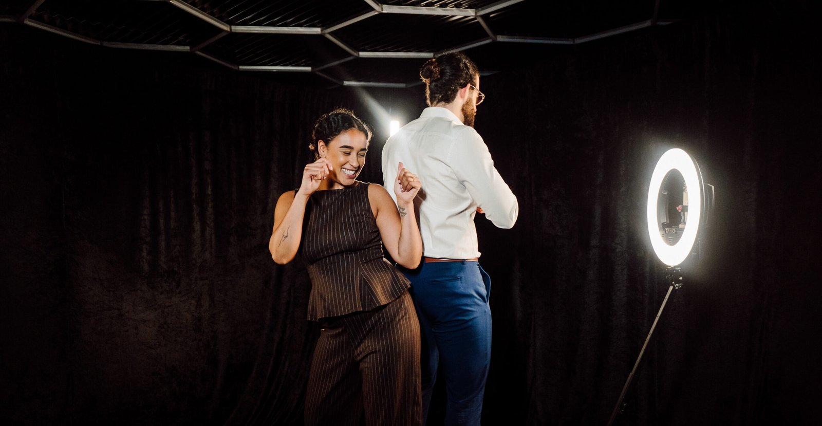 Couple dancing on a 360 video photo booth platform