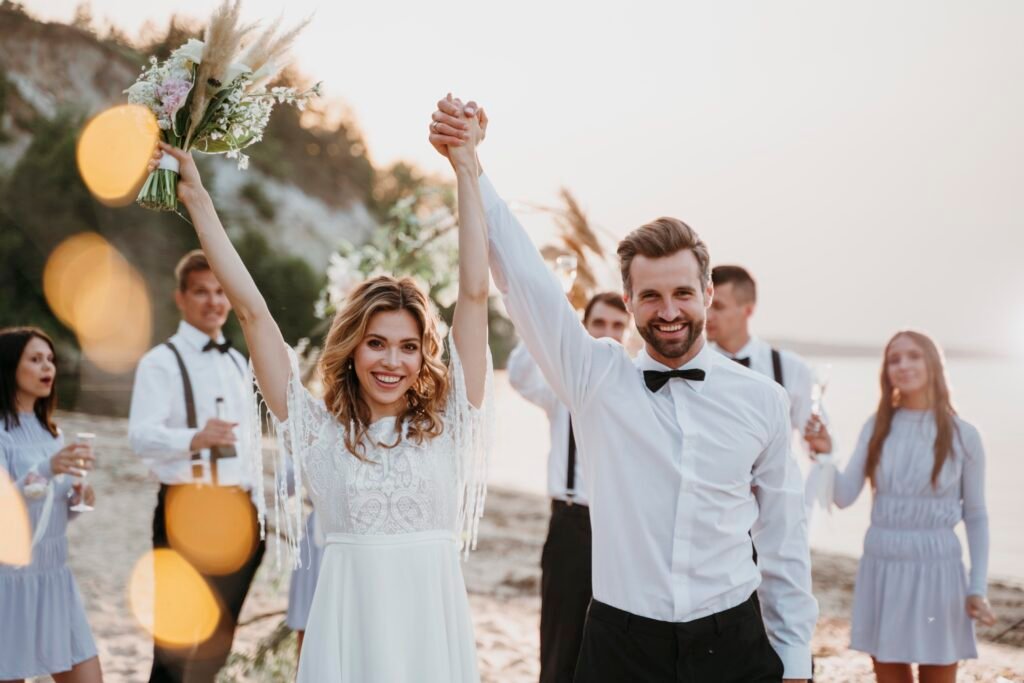 bride groom having their wedding with guests beach