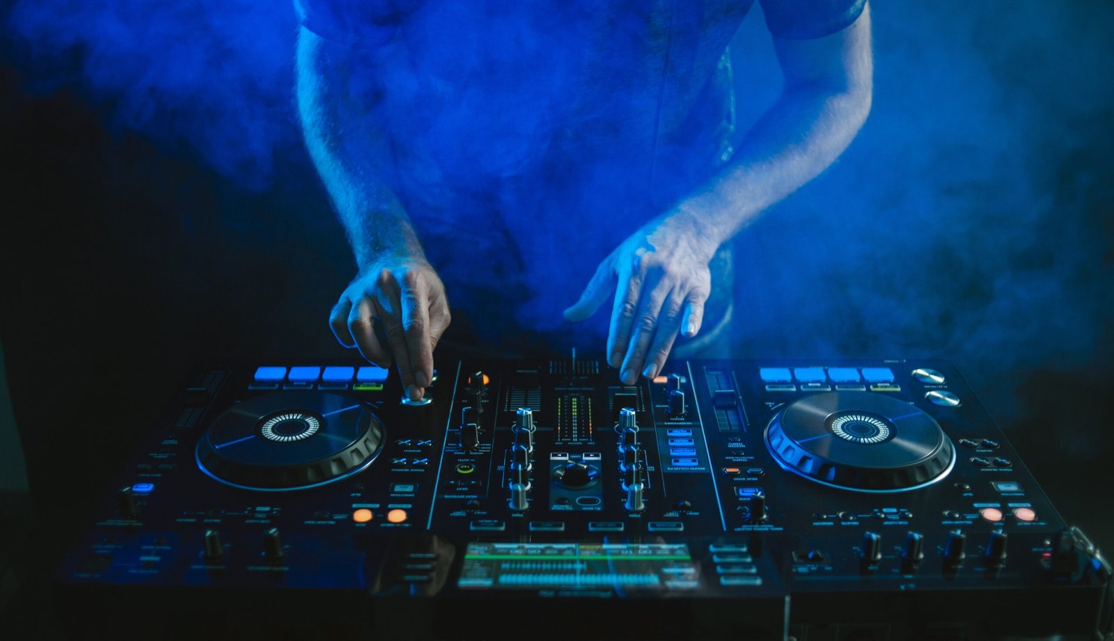 closeup dj working blue light
