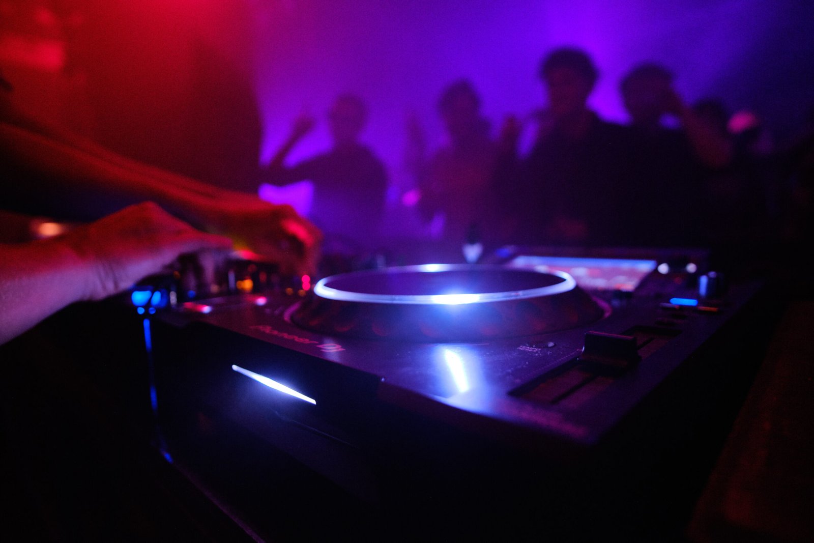 closeup shot dj s equipment people dancing club