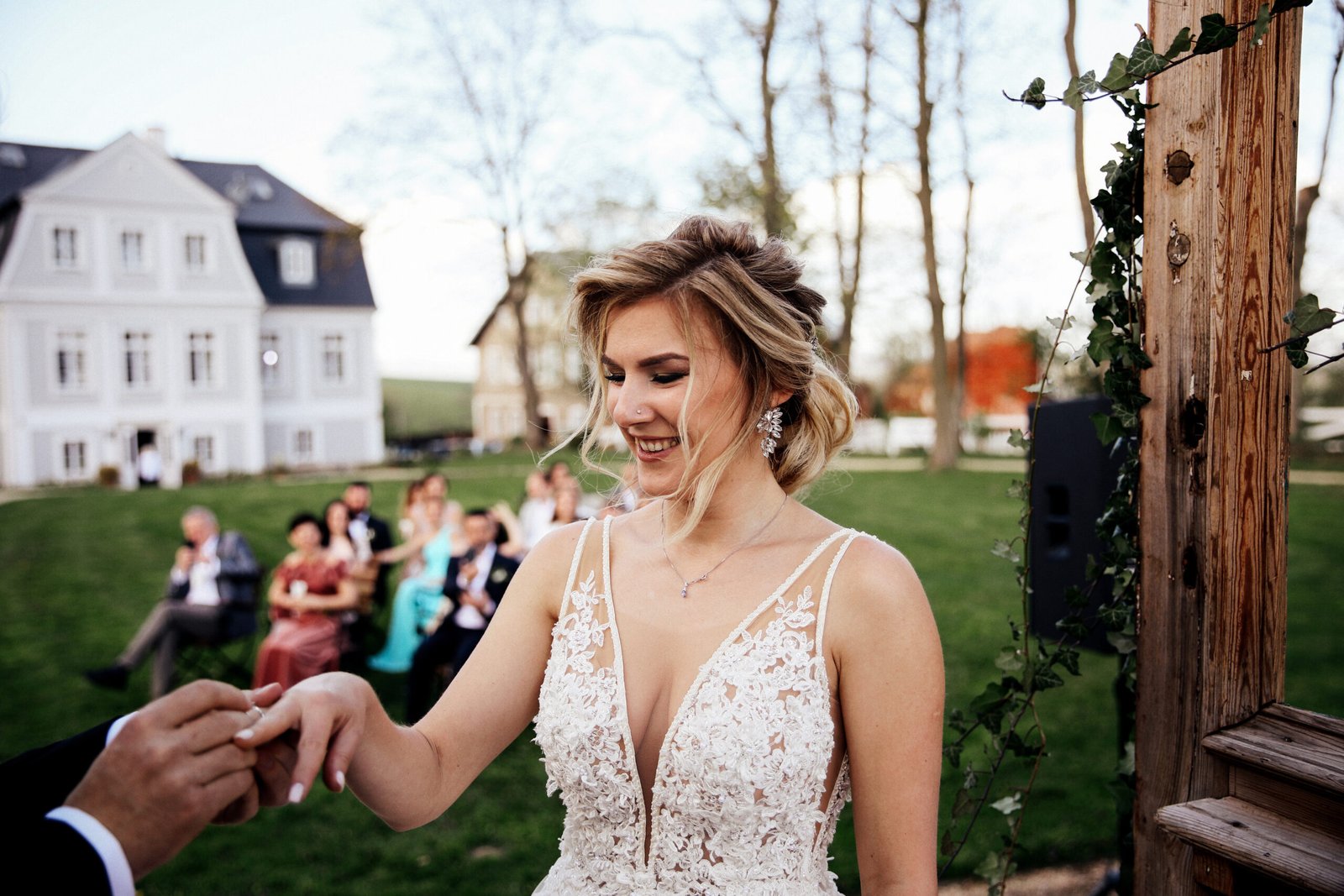 groom is putting wedding ring bride s finger