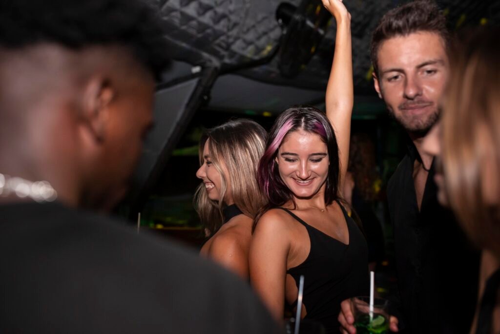 group of people dancing at a club